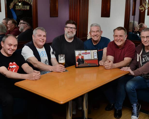 Silverwood Miners Welfare Club's 'Prostate Corner' with their new artwork. From left to right are: Martin Tune, Shaun Garratty, artist Steve White, Alan Tunstill, Chris Caldwell and Martyn Frith.