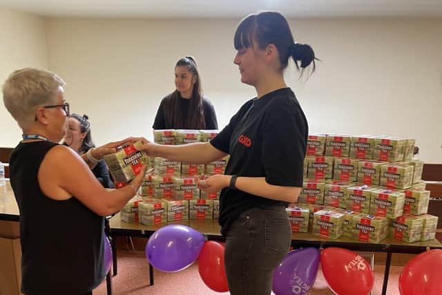 Volunteers from GXO help give out boxes of Yorkshire Tea to DBTH colleagues on the day of the NHS Big Tea