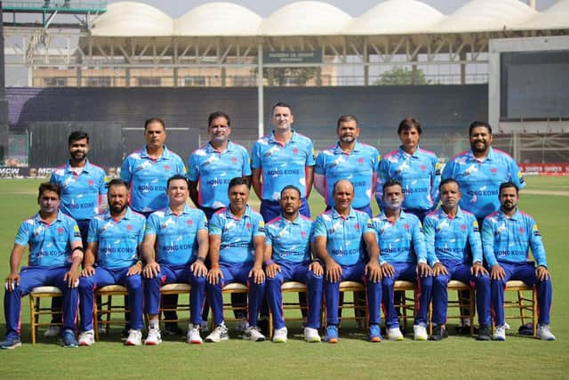 Matt Jones (centre, back row) lines up with Hong Kong's cricket team.