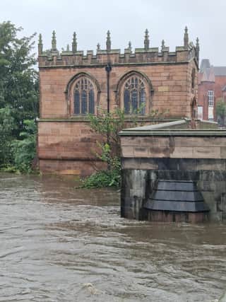 RISING: Water levels by the Chapel on the Bridge