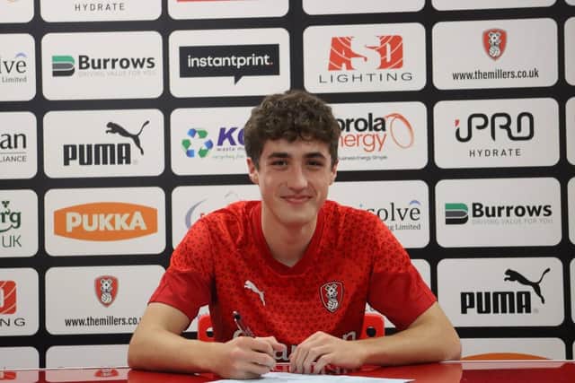 Ben Hatton signs the deal that will see him join Rotherham United's first-team group permanently next season.