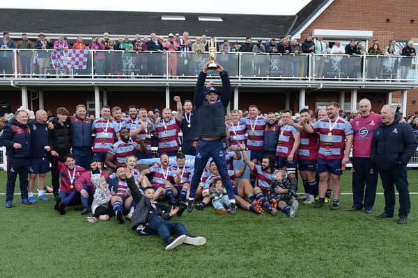 Jumping for joy: Harvey Biljon and Rotherham Titans with the league winners' trophy. Pictures by Kerrie Beddows