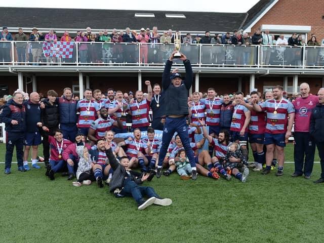 Jumping for joy: Harvey Biljon and Rotherham Titans with the league winners' trophy. Pictures by Kerrie Beddows